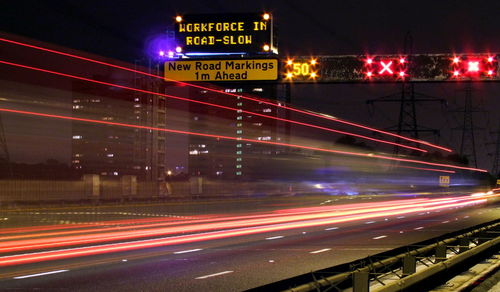 Light trails on road at night