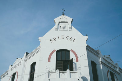 Low angle view of white building against sky