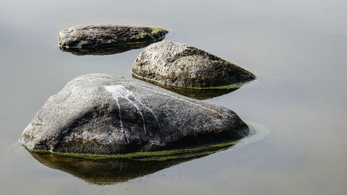 High angle view of rock formation in lake