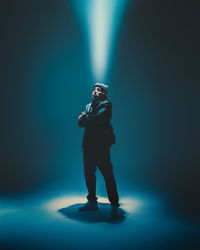 Rear view of man standing on stage