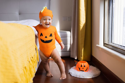 Cute girl wearing costume at home