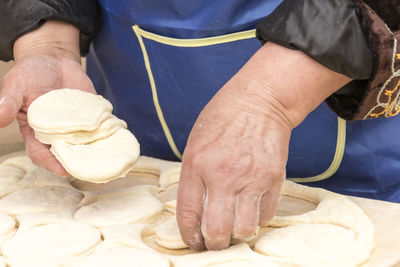 Midsection of man preparing food