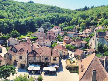 High angle view of townscape by trees