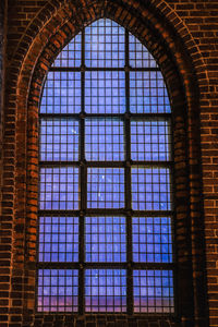 Low angle view of glass window in historic building