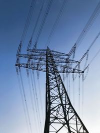 Low angle view of power line against clear sky