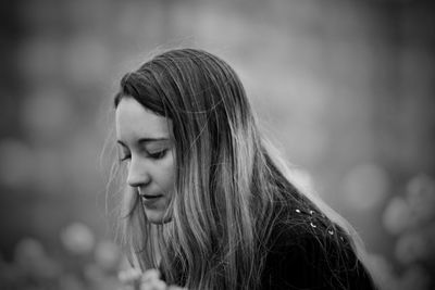 Portrait of woman looking away outdoors