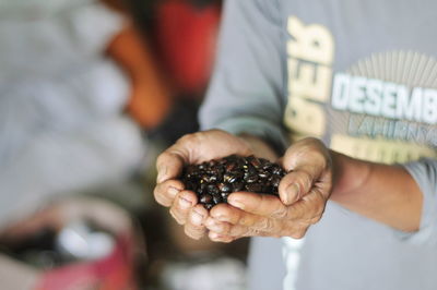 Close-up of man holding ice cream