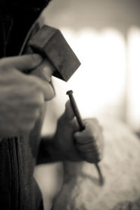 Cropped hand holding cigarette