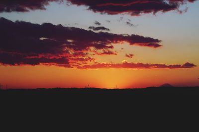 Scenic view of silhouette landscape against sky during sunset