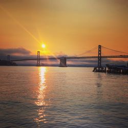 View of suspension bridge at sunset