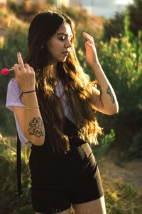 Young woman looking away outdoors