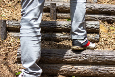 Low section of man standing on staircase