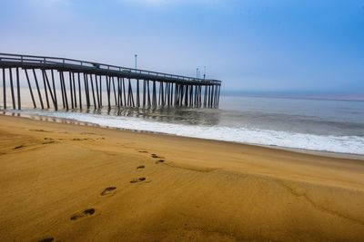 Scenic view of beach against clear sky