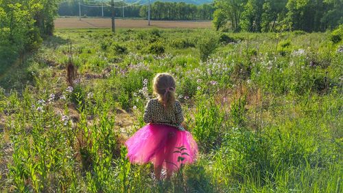 Full length of woman standing on field