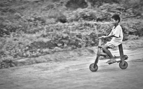 Boy riding bicycle