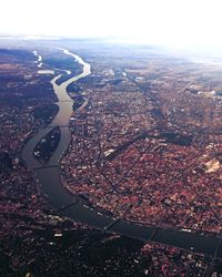 Aerial view of cityscape against sky
