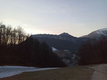 Scenic view of mountains against sky during sunset