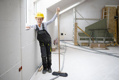 Low angle view of man standing against building