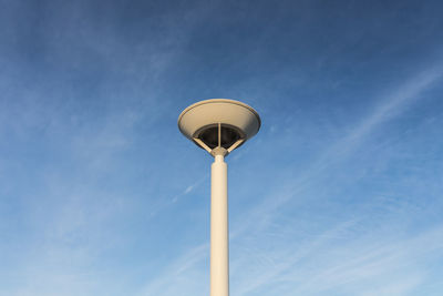 Low angle view of windmill against sky