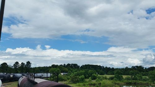 Scenic view of landscape against cloudy sky