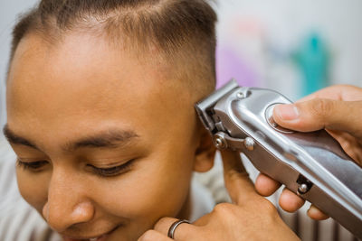 Close-up of man using mobile phone