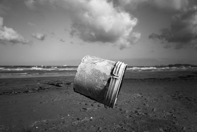 Bin  hut on beach against sky