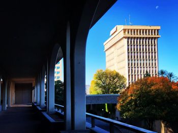 Entrance of building against clear blue sky