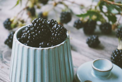 Close-up of blackberries in container on table