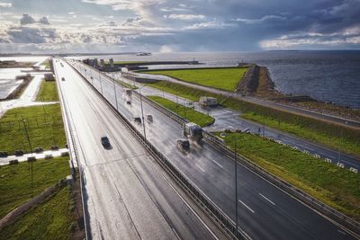 High angle view of road by sea against sky