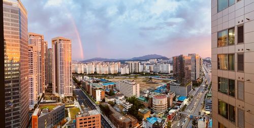 High angle view of buildings in city against sky