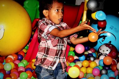 Close-up of boy playing with ball