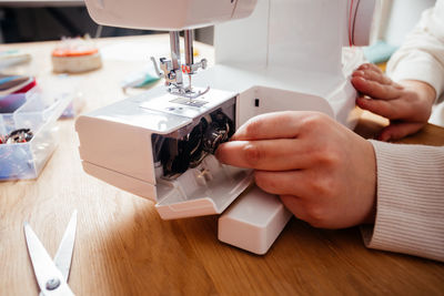 Close-up of person working in tray