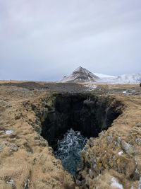 Scenic view of rocky mountains against sky