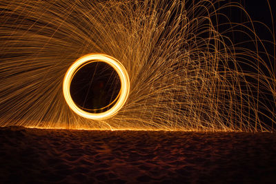 Full frame shot of illuminated light against sky at night