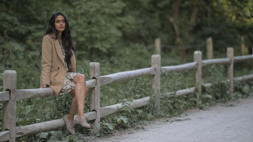 Portrait of woman sitting outdoors