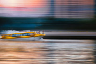 Blurred motion of boat in river