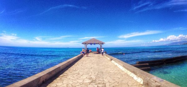 Scenic view of sea against cloudy sky