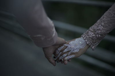 Cropped hand of woman holding snail