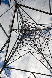 Writing and telephone number removed from this plain image of an electrical pylon.