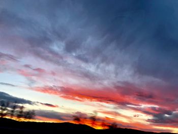 Low angle view of dramatic sky during sunset