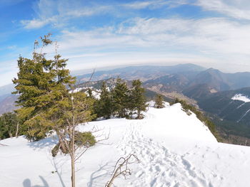 Scenic view of snowcapped mountains against sky