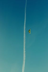 Low angle view of kite flying in sky