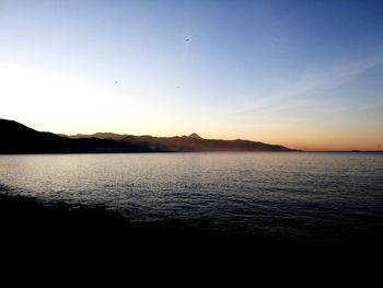 Scenic view of sea at sunset