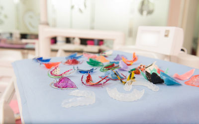 Close-up of multi colored dental equipment on table