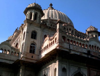 Low angle view of building against blue sky