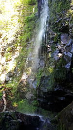 Scenic view of river flowing through rocks