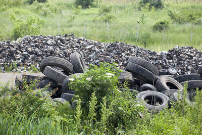 Stack of abandoned truck on field