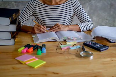 High angle view of woman sitting on table