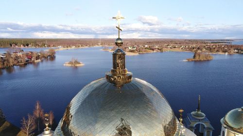 Panoramic view of mosque and buildings against sky