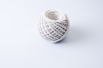 Ball of wool over white background